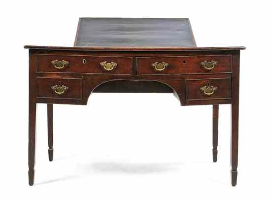 Appraisal: An English Walnut Writing Desk having a rectangular leather inset