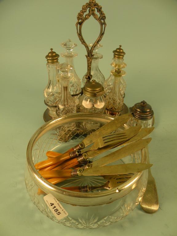 Appraisal: A Victorian silver plated six bottle cruet stand a cut