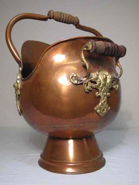 Appraisal: A late th century English copper and brass coal scuttle