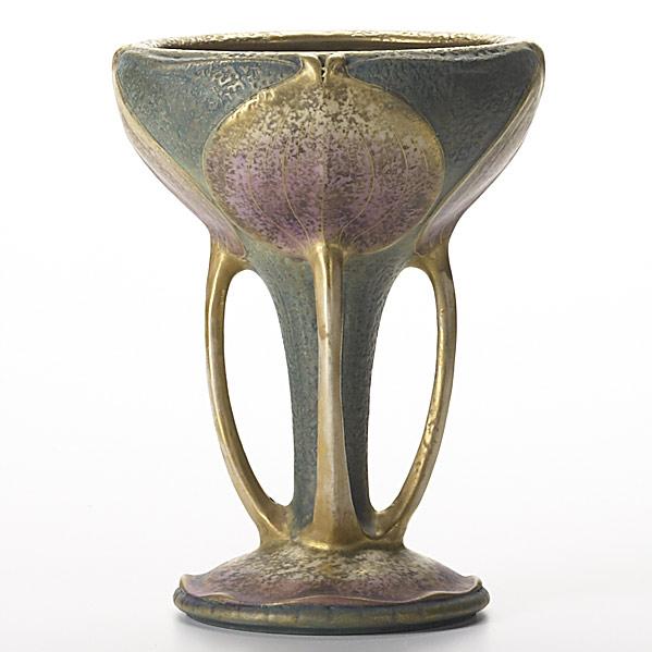 Appraisal: RIESSNER STELLMACHER KESSELAmphora ceramic four-handled vase with leavesWear to goldStamped