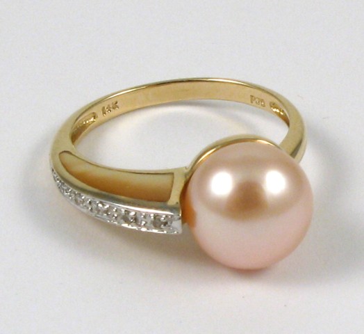 Appraisal: PINK PEARL MOTHER-OF-PEARL AND DIAMOND RING kyellow gold with a