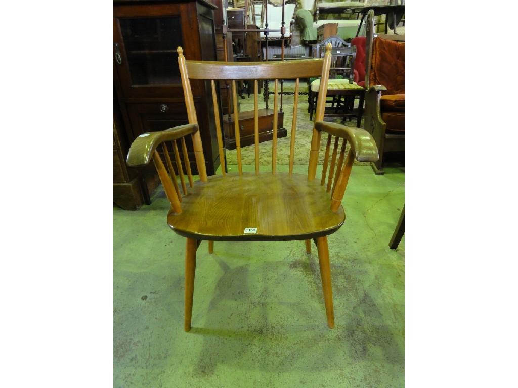 Appraisal: An elm and beech wood spindle back elbow chair in