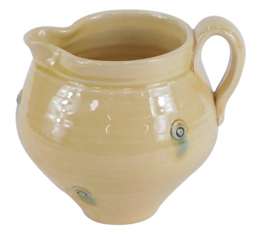 Appraisal: A Fenella Mallalieu studio pottery milk jug on a yellow