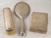 Appraisal: A continental silver hand mirror and clothes brush both marked