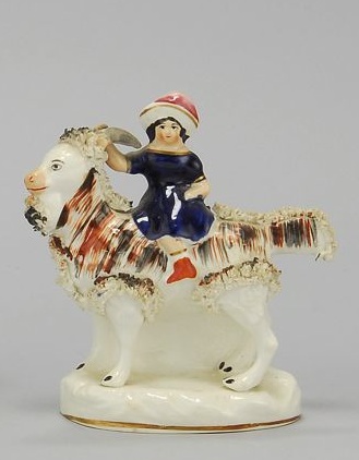 Appraisal: STAFFORDSHIRE FIGURE OF A CHILD RIDING A GOAT Circa Cole