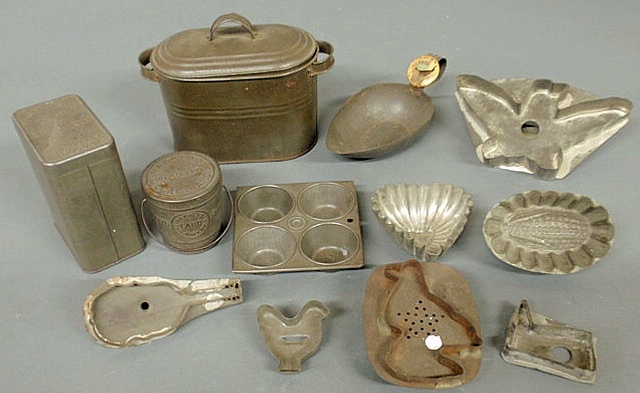 Appraisal: Group of th c tinware- cookie cutters molds canisters miniature