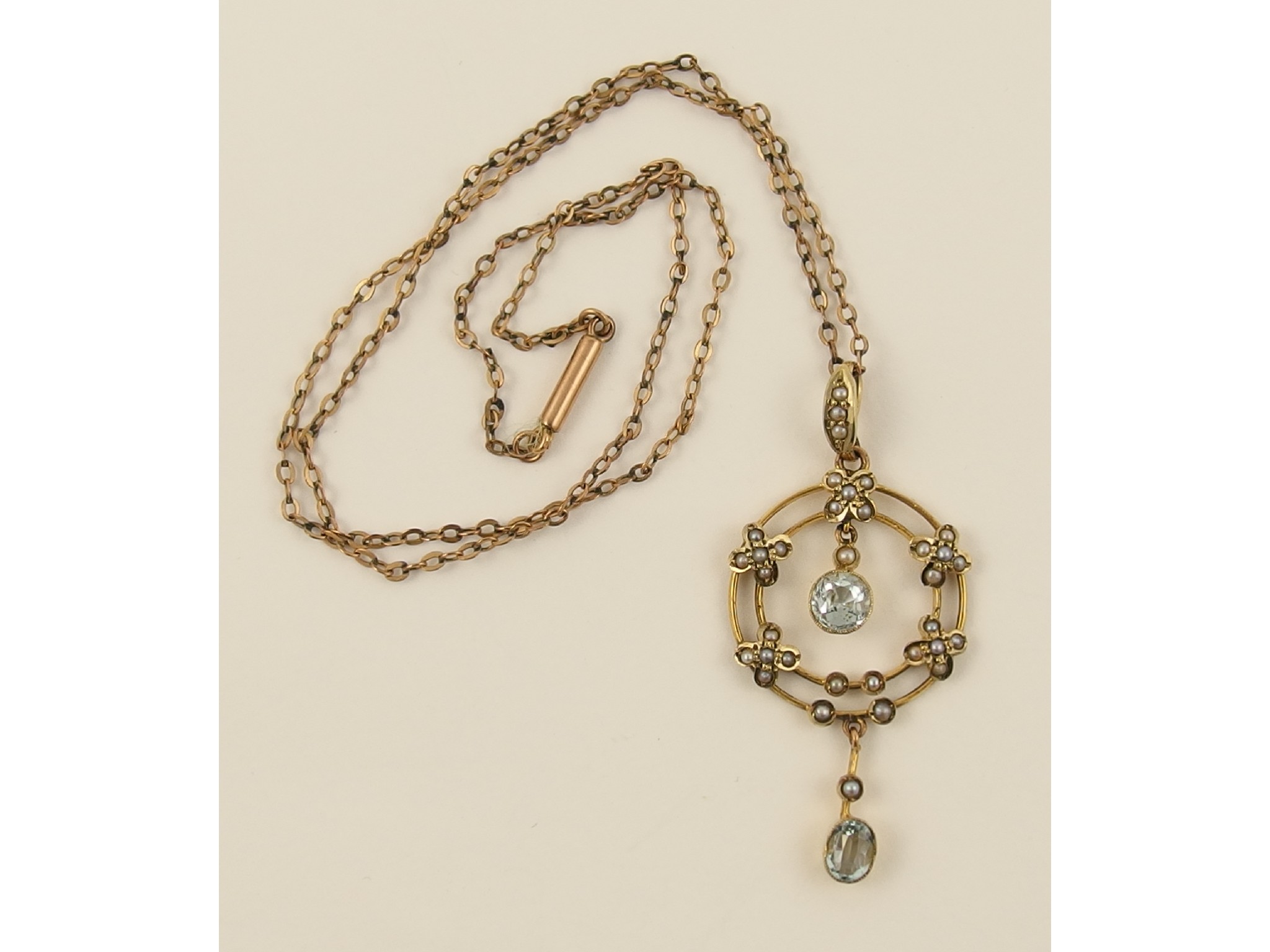 Appraisal: A ct Edwardian aquamarine and split pearl pendant and chain