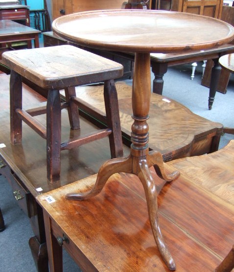 Appraisal: A mahogany and beech framed circular occasional table raised on