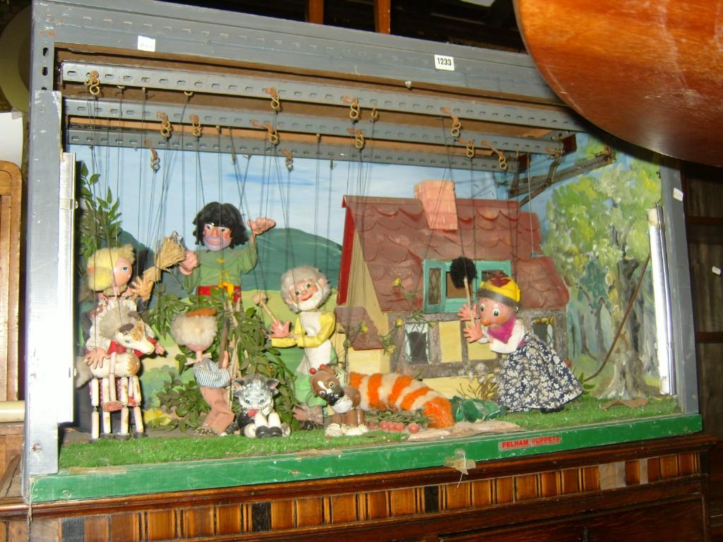 Appraisal: A toy theatre fitted with various Pelham puppets