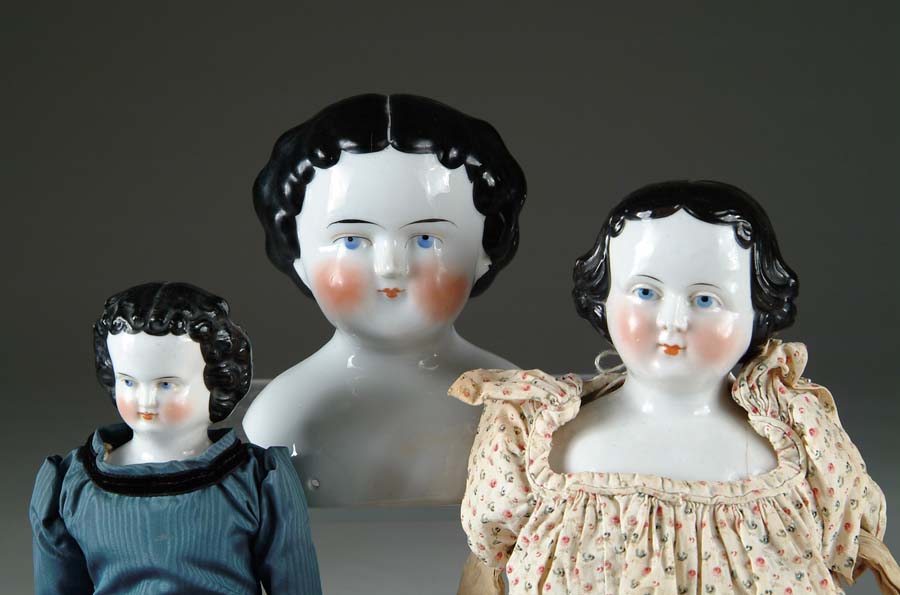 Appraisal: THREE CHINA HEAD DOLLS All three have greiner style hairdos