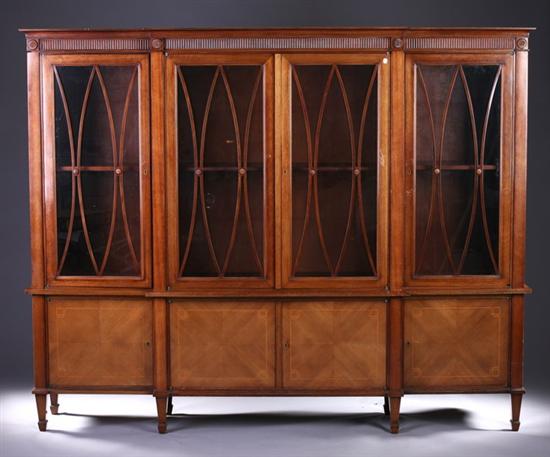 Appraisal: GEORGE III STYLE INLAID MAHOGANY BREAKFRONT-BOOKCASE th century Flat molded