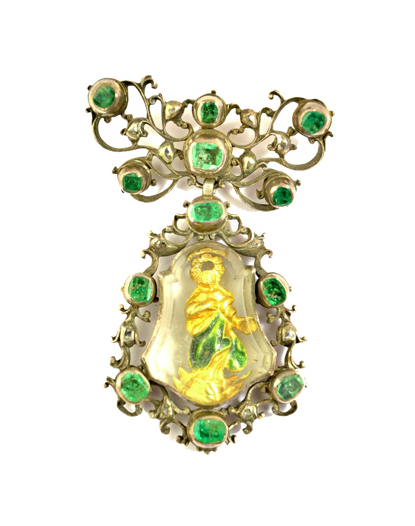 Appraisal: A foil backed emerald and diamond set devotional pendant the