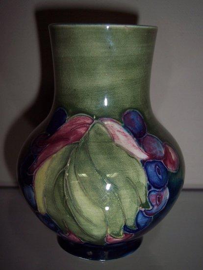 Appraisal: A Grape and Leaf pattern pear shaped vase of green