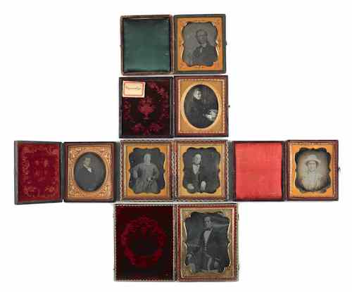 Appraisal: Four daguerreotypes of men holding books th c together with