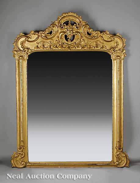 Appraisal: An American Rococo Carved Giltwood Overmantel Mirror mid- th c