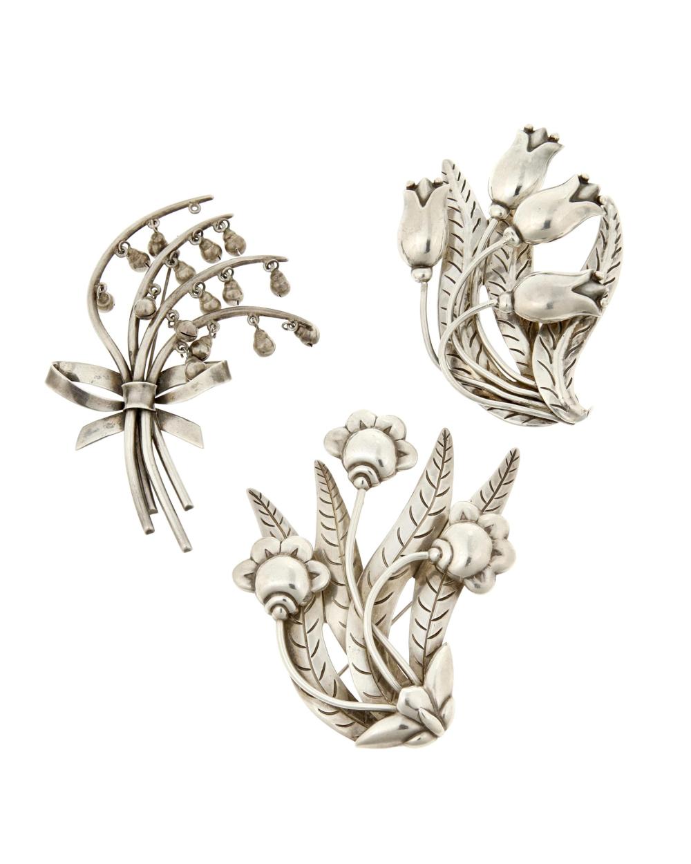 Appraisal: A group of Hector Aguilar sterling silver floral brooches Hector