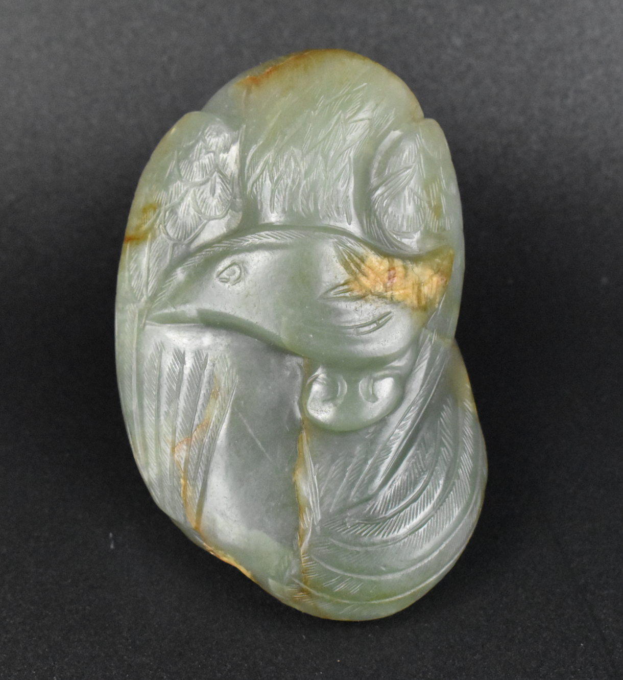 Appraisal: A Chinese spinach jade carved phoenix dating from the Qing