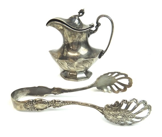 Appraisal: A Sterling silver octagonal baluster shaped small hinge lidded jug