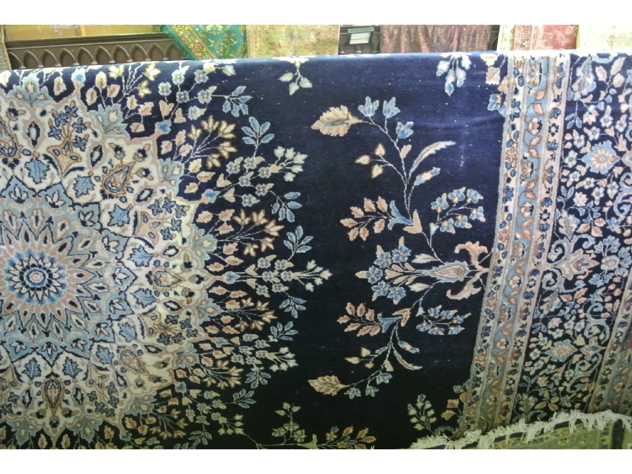 Appraisal: A substantial good quality woven wool rug the deep navy