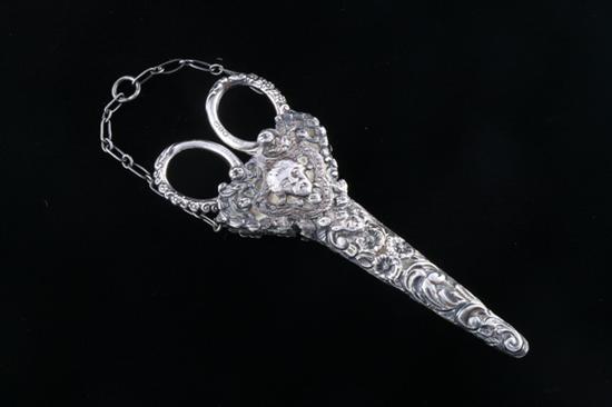 Appraisal: PAIR ENGLISH VICTORIAN STERLING SCISSORS IN RENAISSANCE REVIVAL REPOUSSE SHEATH