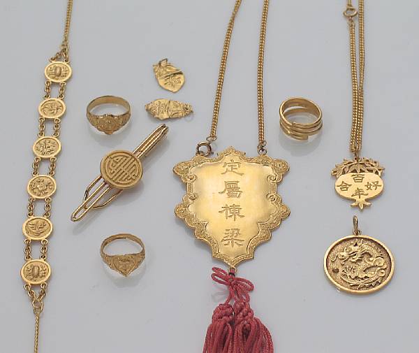 Appraisal: A collection of high karat gold jewelry including three pendants