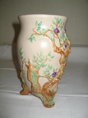 Appraisal: A CLARICE CLIFF BALUSTER VASE moulded with flowering branches on