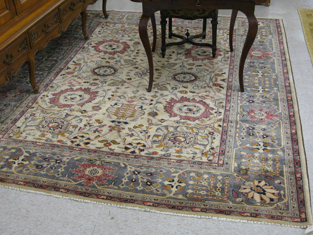 Appraisal: HAND KNOTTED ORIENTAL CARPET Pakistani Persian overall floral design on