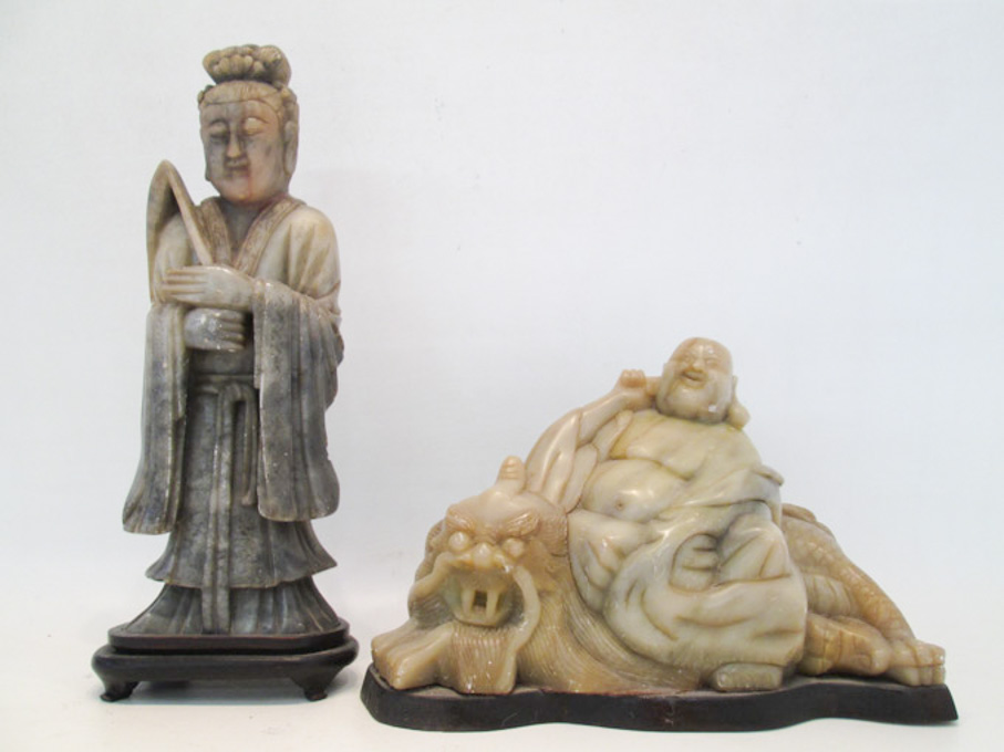 Appraisal: TWO CHINESE CARVED FIGURAL SCULPTURES a large male figure seated