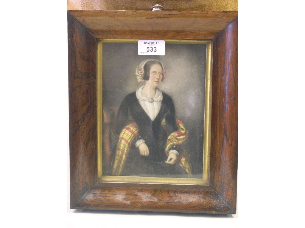 Appraisal: A Victorian half-length portrait of a seated lady painted on