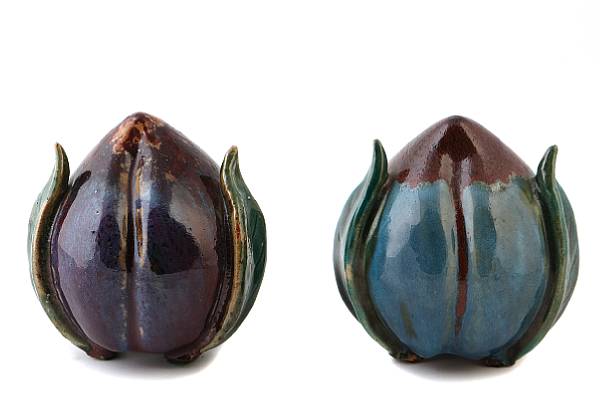 Appraisal: Two Chinese polychrome glazed pottery models of peaches height in