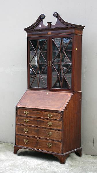 Appraisal: A George III satinwood inlaid mahogany secretary bookcase secretary late