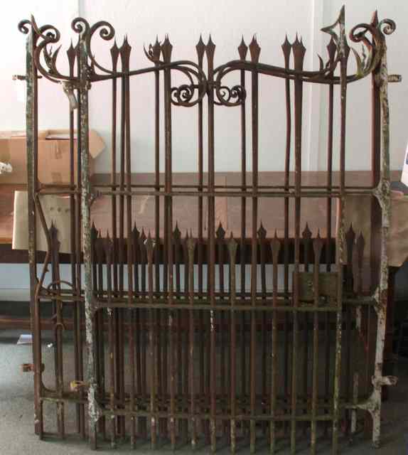 Appraisal: A pair of wrought iron garden gates with scroll work