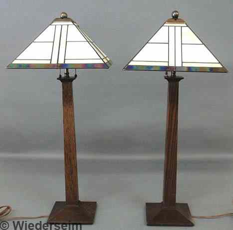 Appraisal: Pair of contemporary oak table lamps signed Stickley with glass