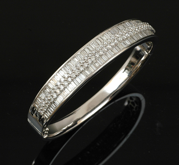 Appraisal: A diamond bangle The ct white gold hinged bangle centrally