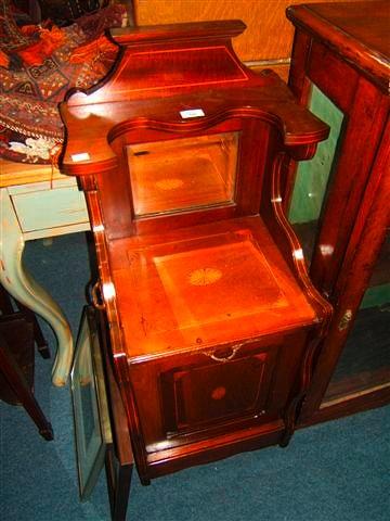 Appraisal: An Edwardian mahogany coal purdonium with raised mirrored back wide