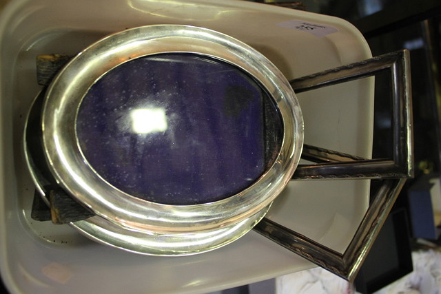 Appraisal: A PAIR OF SILVER PHOTOGRAPH FRAMES of plain oval form