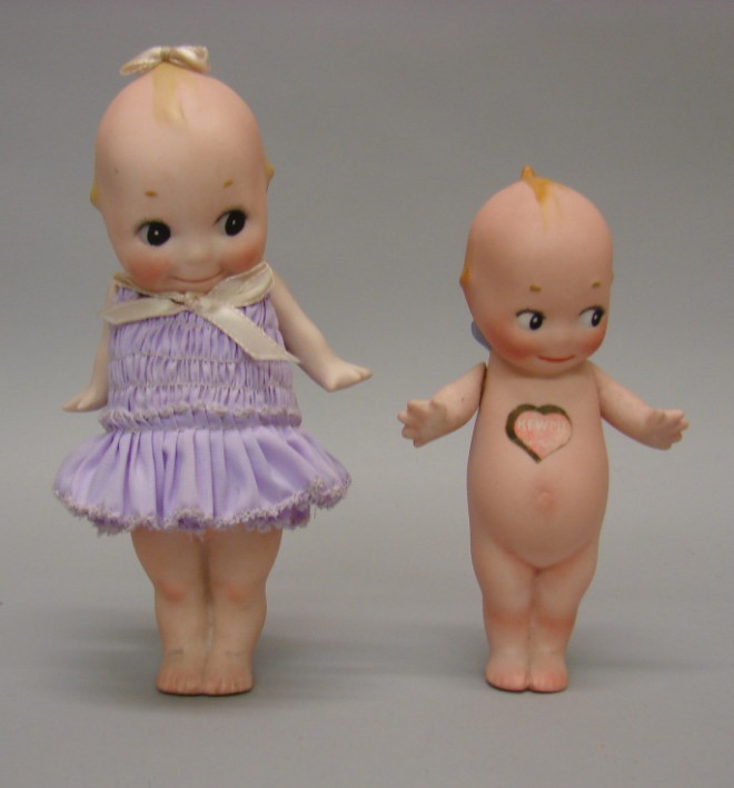 Appraisal: Pair of standing Kewpie dolls and dolls with a paper