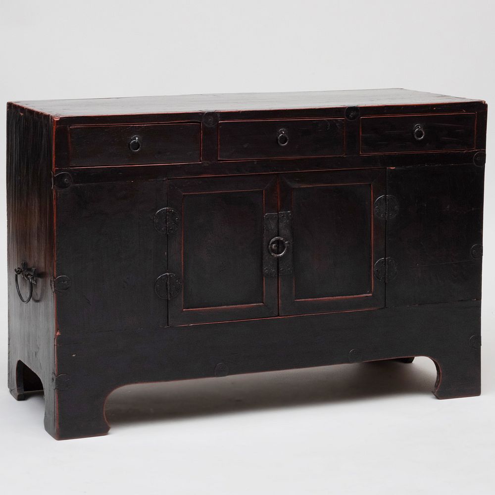 Appraisal: Korean Metal-Mounted Ebonized Low Chest with Red Trim x x