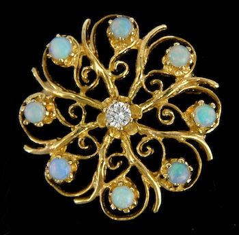 Appraisal: A Gold Brooch Set with a Diamond and Opals The