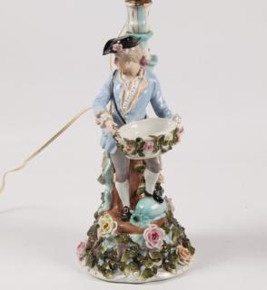 Appraisal: DRESDEN PORCELAIN FIGURAL CANDLESTICK OF FRENCH MAN HOLDING A BASKET