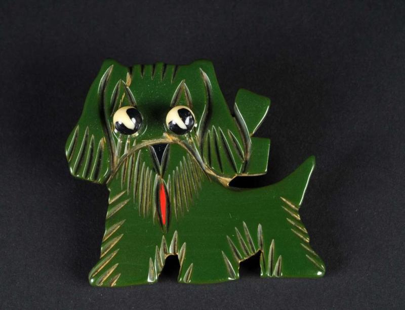 Appraisal: Bakelite Green Dog Pin Description With applied black and white