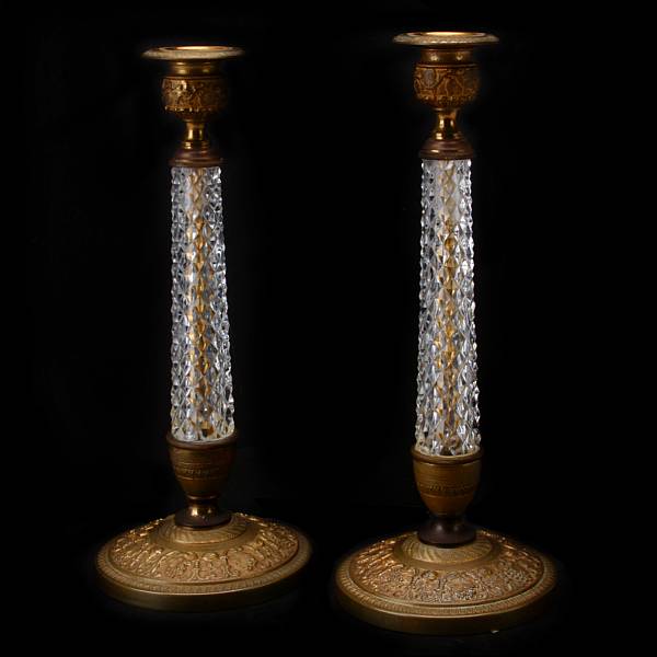 Appraisal: A pair of Empire gilt bronze and cut glass candlesticks