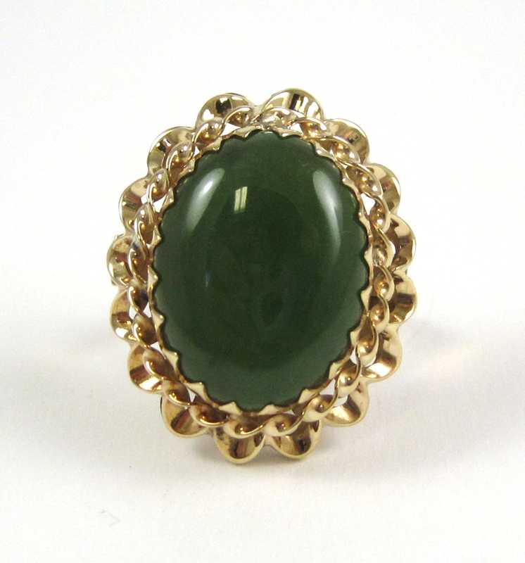 Appraisal: JADE AND FOURTEEN KARAT ROSE GOLD RING set with a