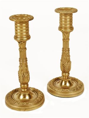 Appraisal: A pair of gilt brass candlesticks in early th century