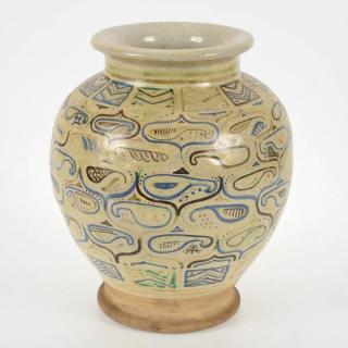 Appraisal: Islamic glazed earthenware vase th c geometric design h x