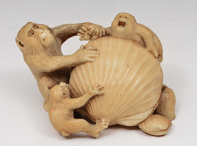 Appraisal: A Japanese ivory okimono of a monkeyMeiji periodthe monkeys grappling