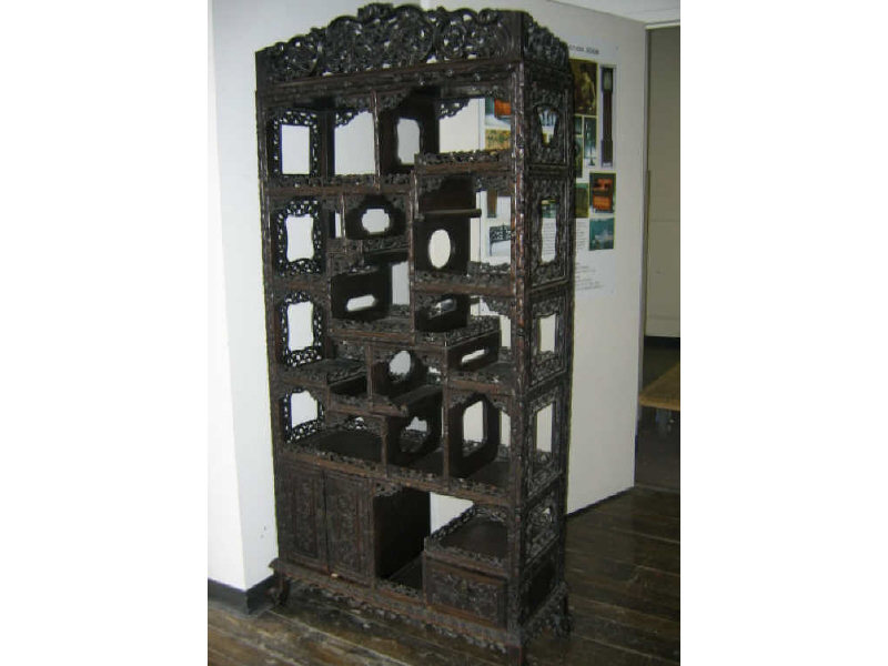 Appraisal: CHINESE HARDWOOD ETEGERE Elaborately carved allover with pierced grapevine and