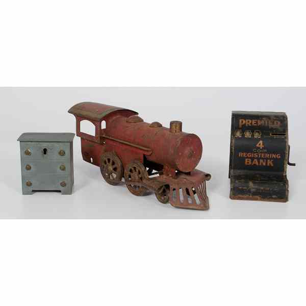 Appraisal: Tin Train Engine and Banks Including a red painted tin