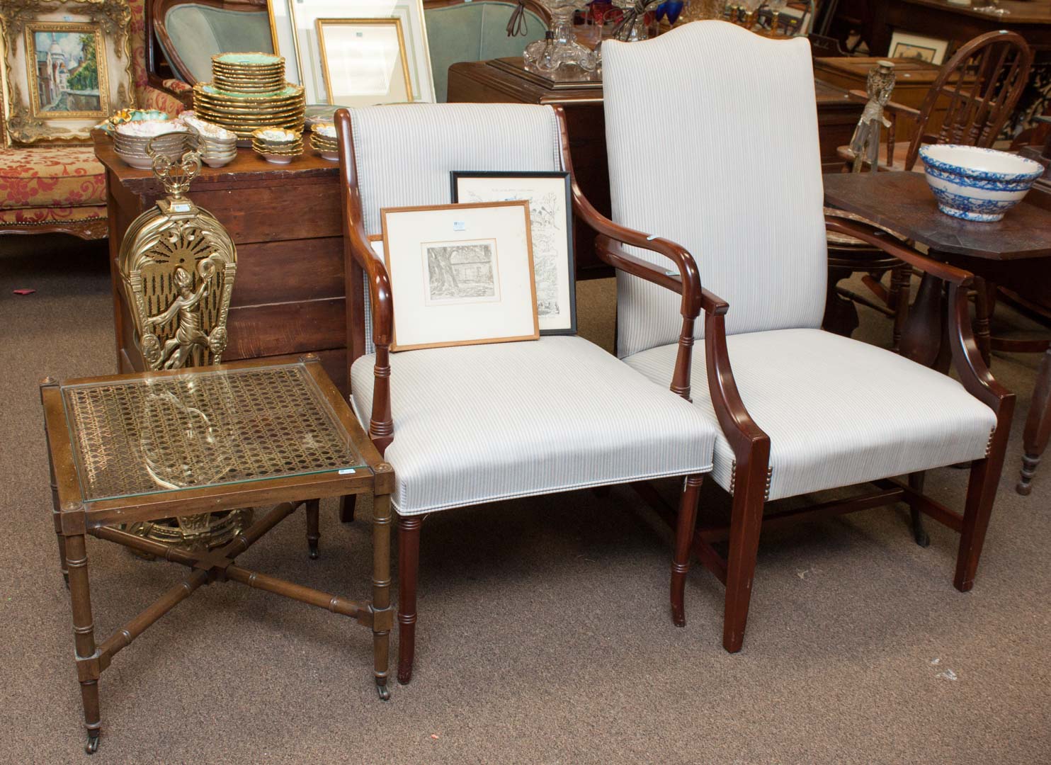 Appraisal: Two upholstered armchairs and a coffee table