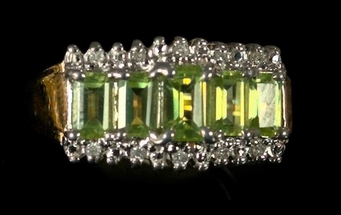 Appraisal: Fourteen-Karat Yellow Gold Peridot and Diamond Ring featuring five emerald-cut